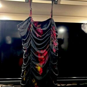 I gather dress with pinks and red flowers in mash over the top